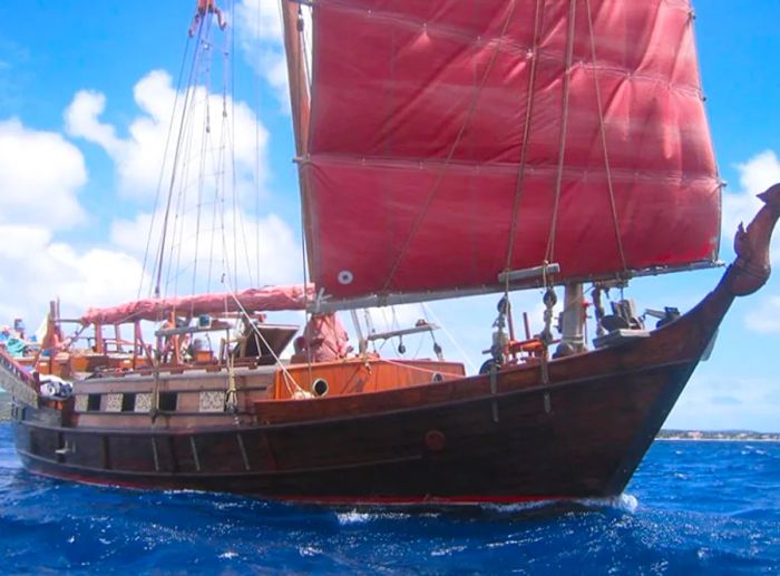 Siamese junk - the sailing vessel Samur navigating the waters of Bonaire