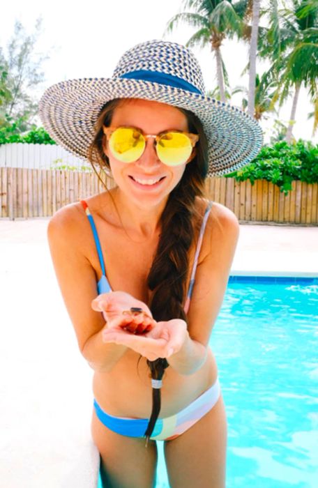 Drea holding a tiny crab