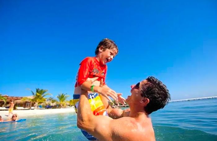 father and son enjoying time in the water