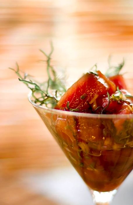 A serving of Hawaiian poke presented in a martini glass