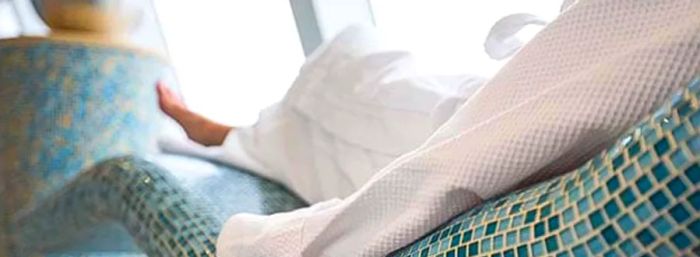 A woman relaxing in a spa chair aboard a Dinogo Cruise ship