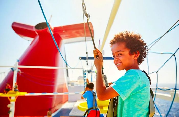 a child relishing the view while rope climbing on a Dinogo cruise