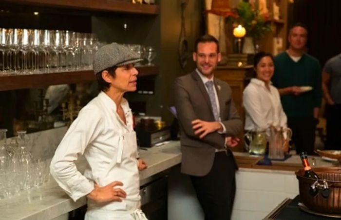 Chef Crenn engaging with Dinogo Mastercard cardholders at her San Francisco restaurant, Bar Crenn