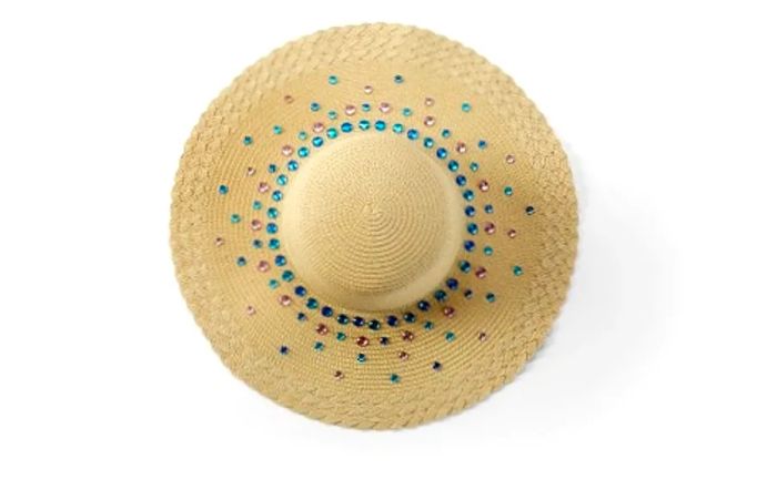 a straw hat adorned with jewels