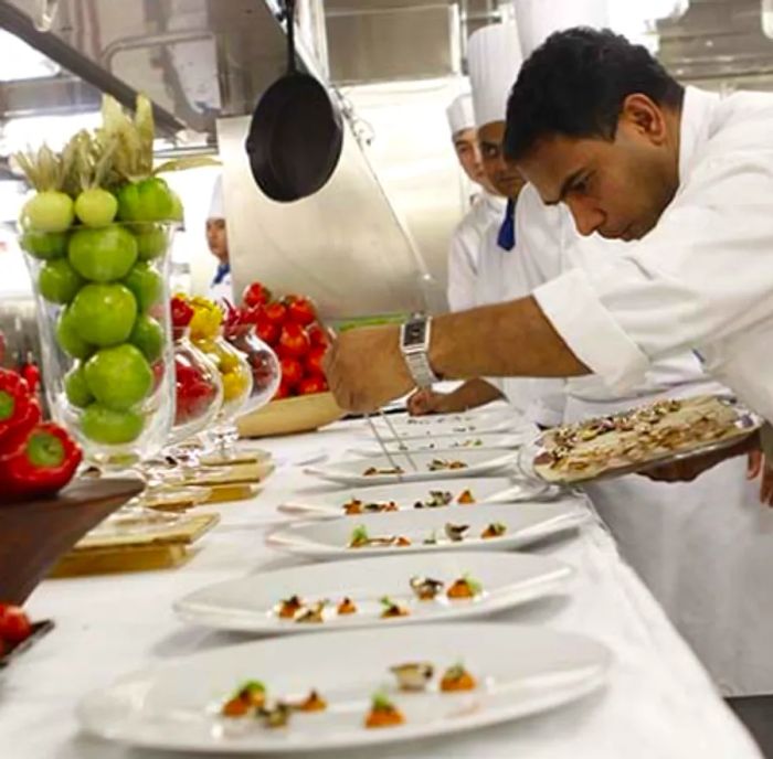 chef preparing dishes for a multi-course dinner