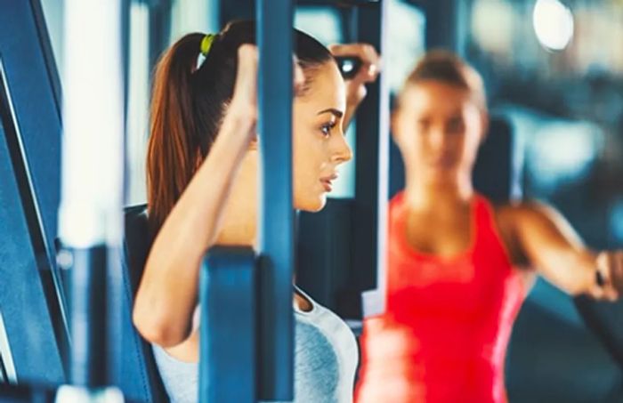 two women exercising at the fitness center