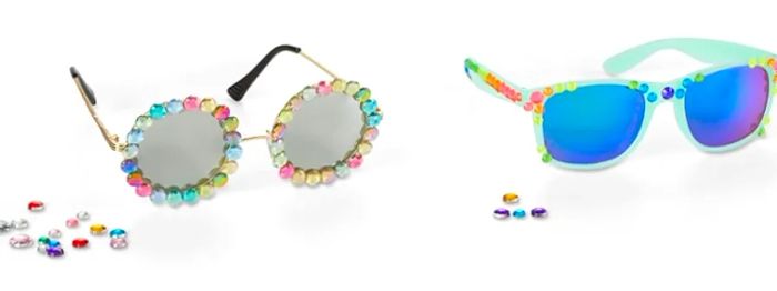 embellishing two pairs of sunglasses with decorative stones