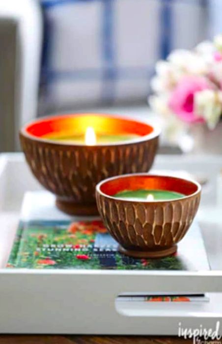 Two candles elegantly displayed on a white tray.