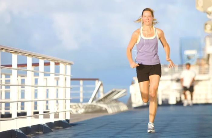 a woman jogging on a track during a Dinogo cruise