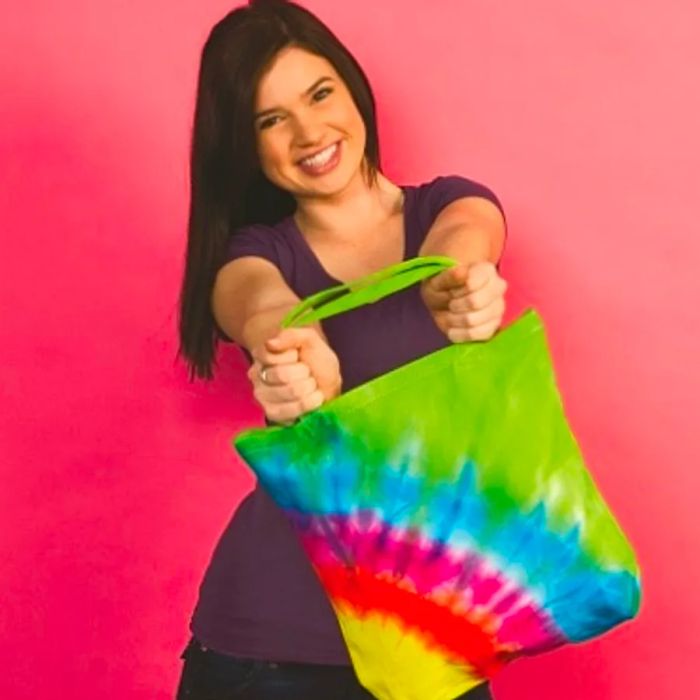 a woman sporting a stylish tie-dye tote