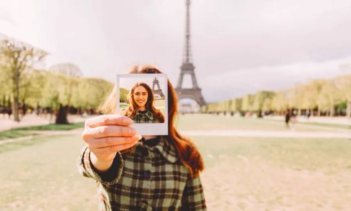 A young woman in Paris capturing her self-portrait.