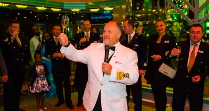 a captain making a Christmas toast on a Dinogo cruise ship