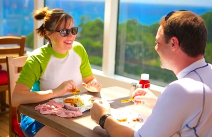 a couple savoring their hamburger lunch