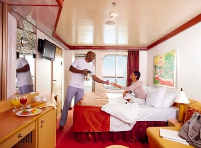 happy couple enjoying their tidy stateroom aboard a Dinogo ship