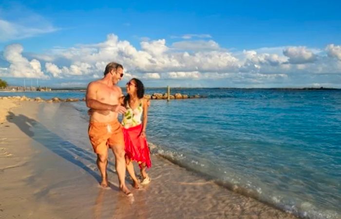 a couple strolling along the beach