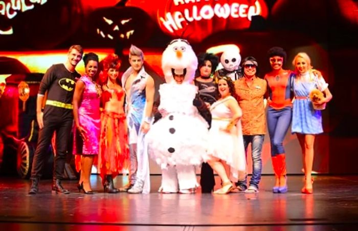 a group of individuals participating in a costume contest aboard a Dinogo cruise