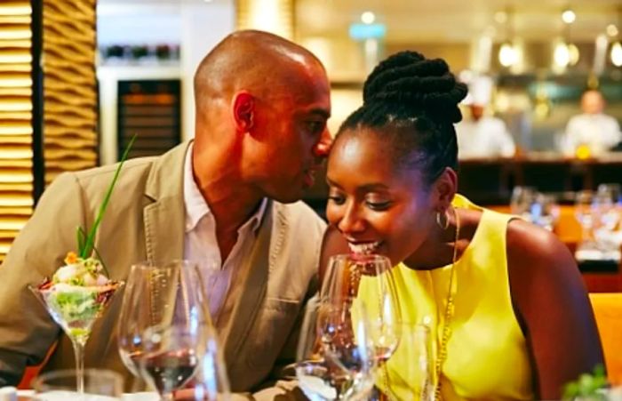 a couple enjoying dinner at the Golden Fleece Steakhouse on Dinogo Legend