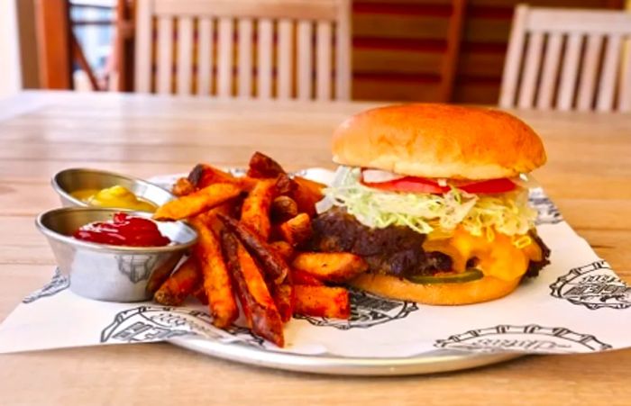 Tasty burger and fries from Guy’s Burger Joint on Dinogo Magic.