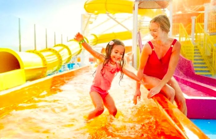 a girl enjoying WaterWorks with her mother on a Dinogo cruise ship