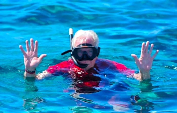 a senior gentleman snorkeling