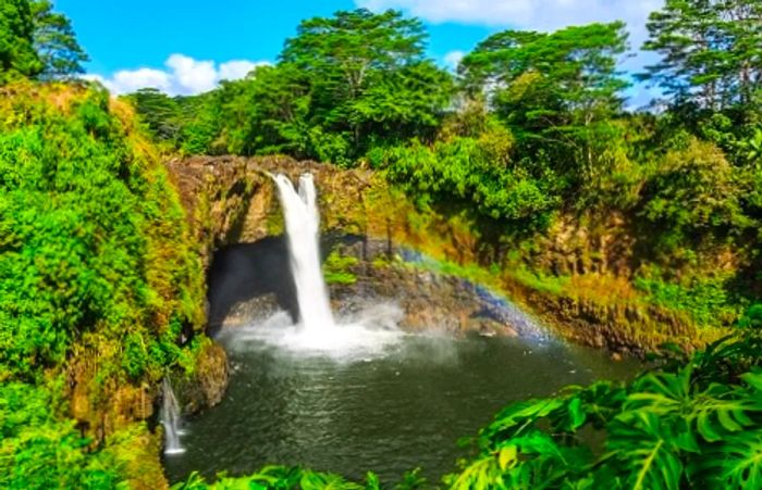 aerial view of the breathtaking Hilo waterfalls in Hawaii on a sunny day