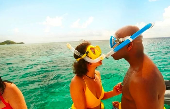 a couple preparing to snorkel together before a Caribbean adventure