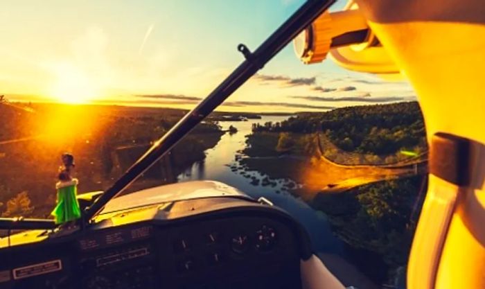 a view of the Alaskan landscape from a seaplane during sunset