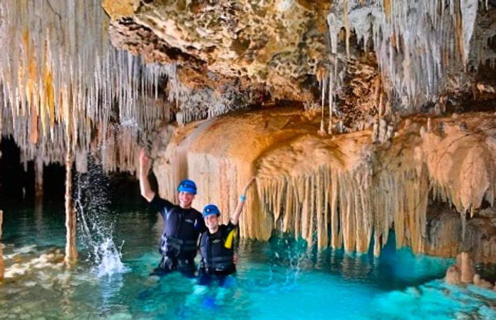 a couple enjoying the caves of the Amazing Secret River