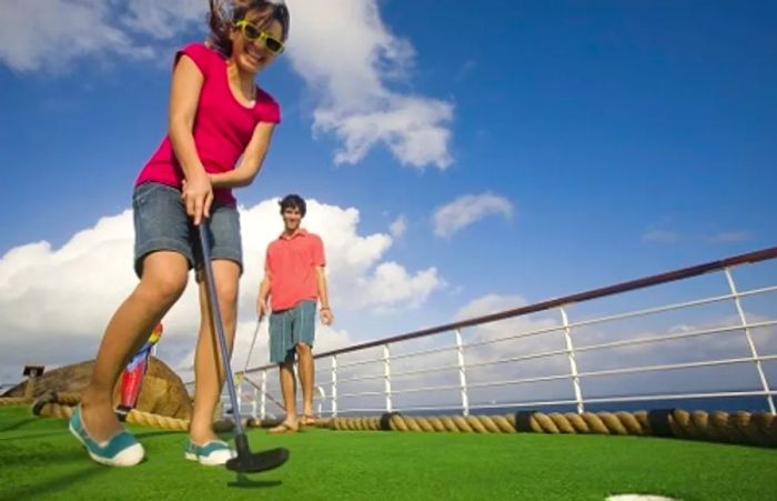 a boy and girl enjoying mini golf on Dinogo Valor