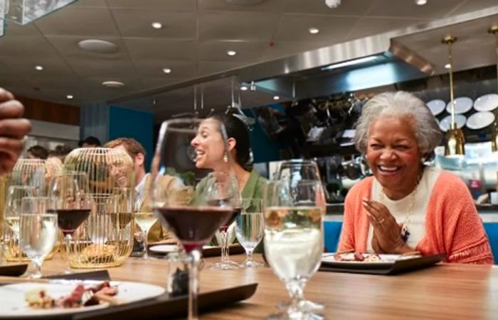 diners enjoying a meal at the chef's table on Dinogo Horizon