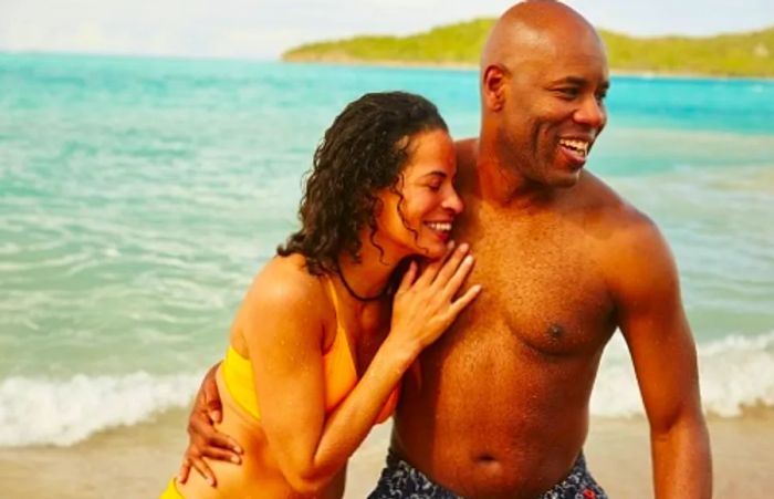 a couple enjoying each other's company on a beach at an island