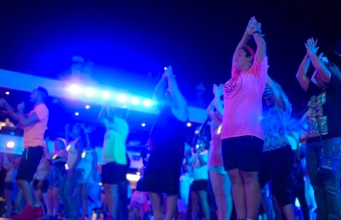 guests enjoying themselves while dancing under the stars at the Mega Deck Party