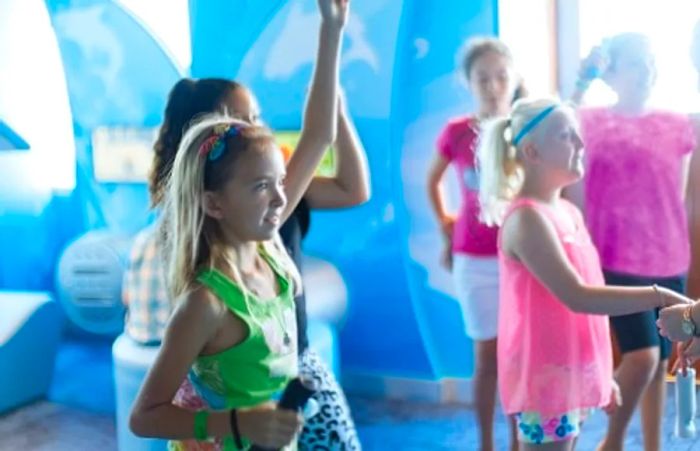 girls enjoying a game at Dinogo Magic’s Camp Ocean