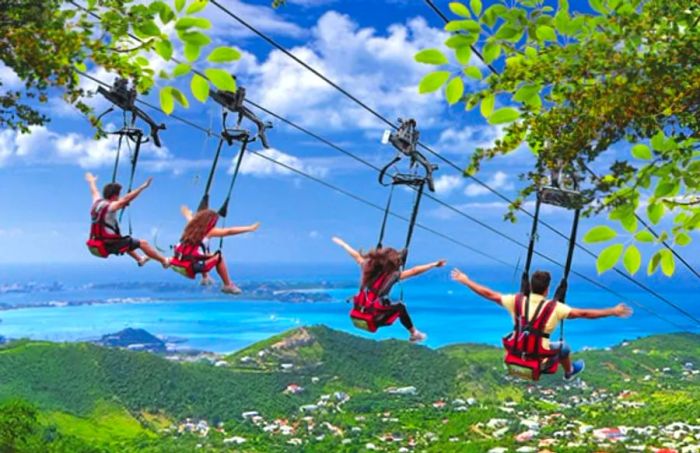 Four friends soaring down the Flying Dutchman, the world’s steepest zip line