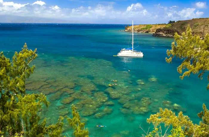 a white yacht cruising in Maui, Hawaii