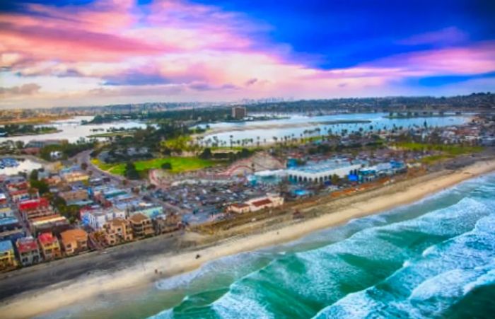 An aerial view of Mission Beach featuring the famous roller coaster in San Diego