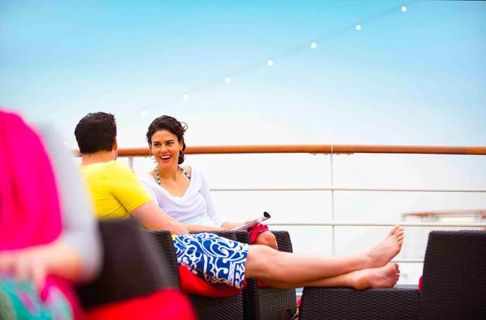 a couple unwinding on the onboard deck