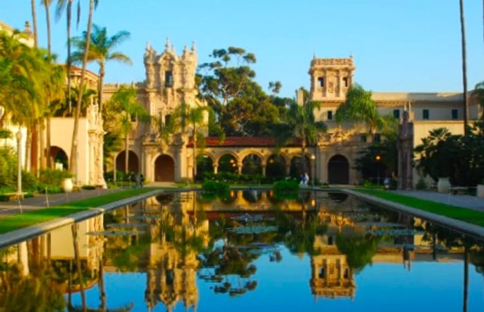 Museum buildings mirrored in a lily pond at Balboa Park