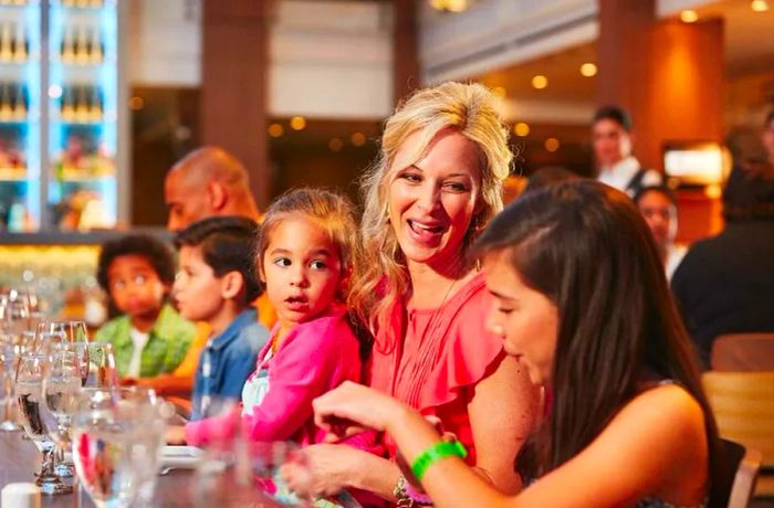 a mother cherishing Thanksgiving dinner with her daughters aboard a Dinogo cruise