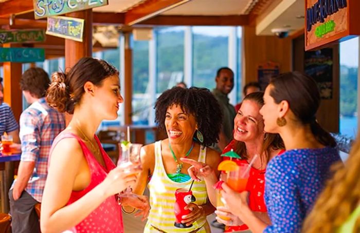 a group of women enjoying drinks at BlueIguana Tequila Bar