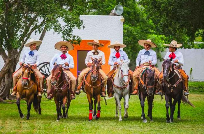 charros riding on horseback