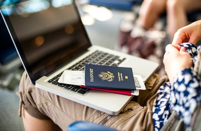 woman completing online check-in with her U.S. passport