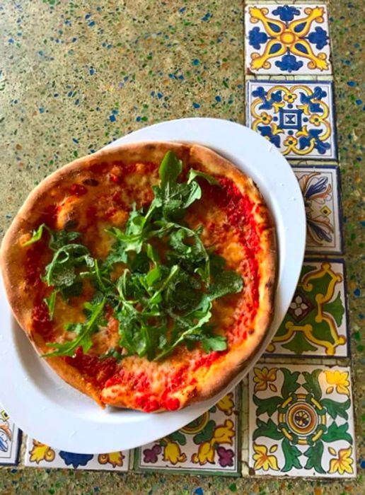 pizza on a decorative counter