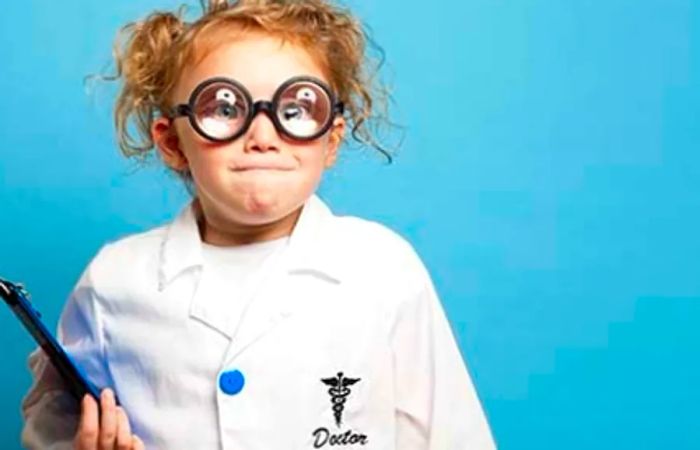 little girl in a crazed doctor costume