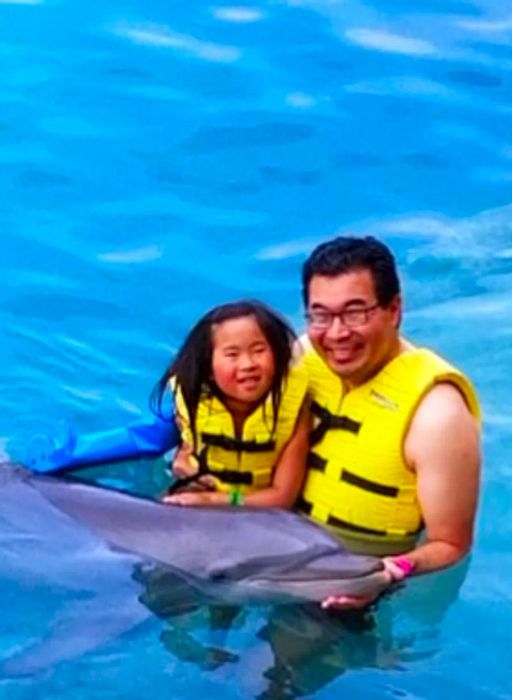 father and daughter enjoying the water