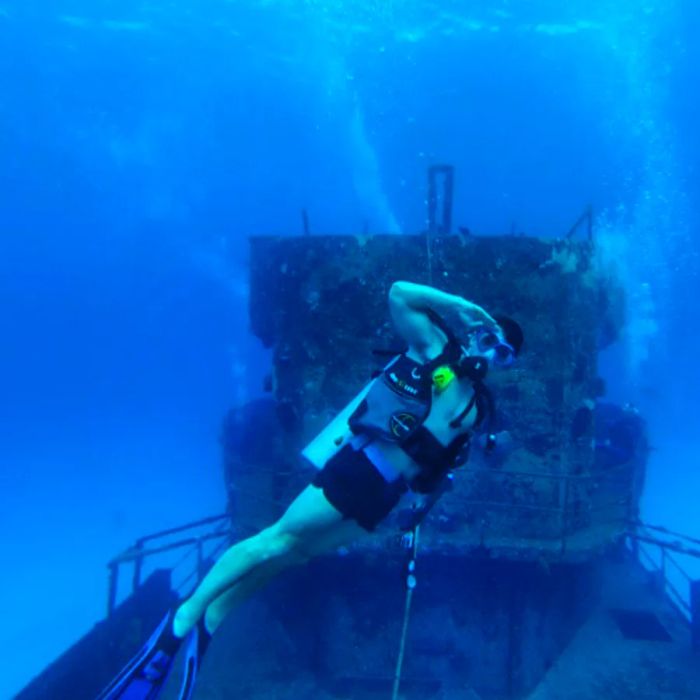 scuba diver beneath the waves