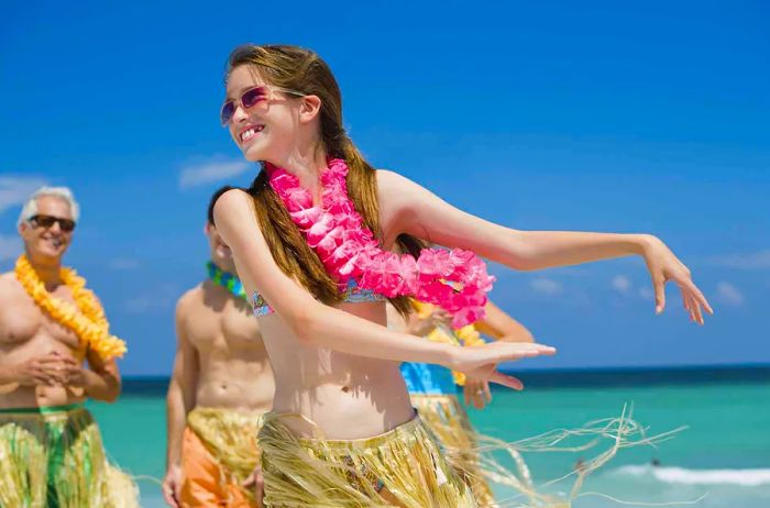 girl dressed as a Hawaiian hula dancer on the beach