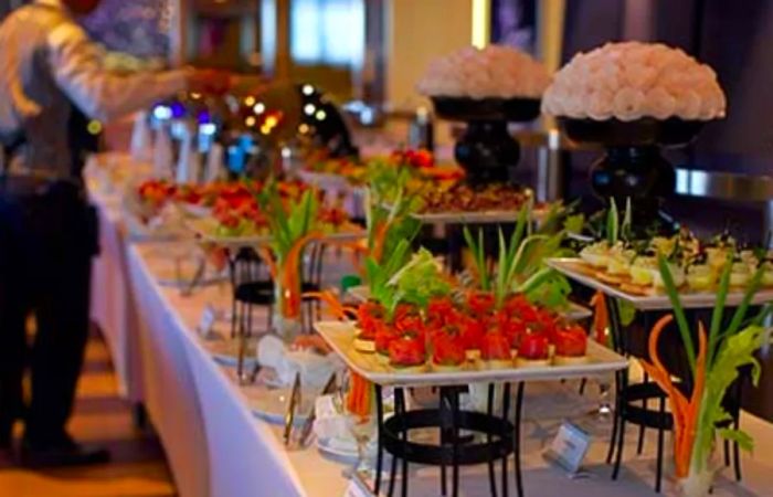 a server at a wedding buffet on a cruise