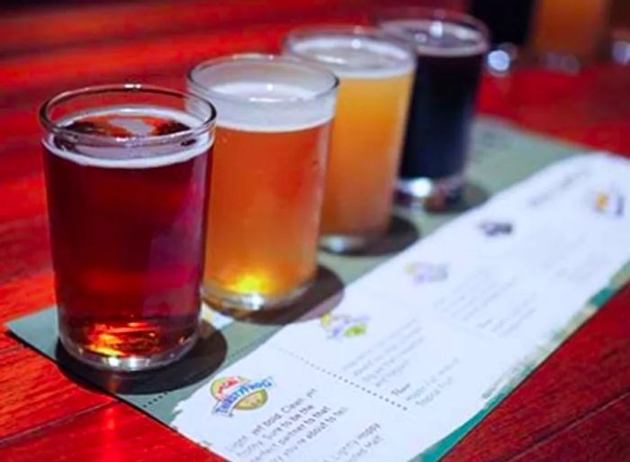 A tasting flight featuring four different beers at the Red Frog Pub and Brewery on the Dinogo ship.