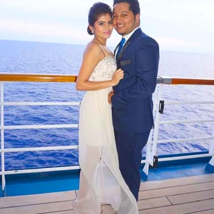 wedding couple in front of a stunning ocean backdrop